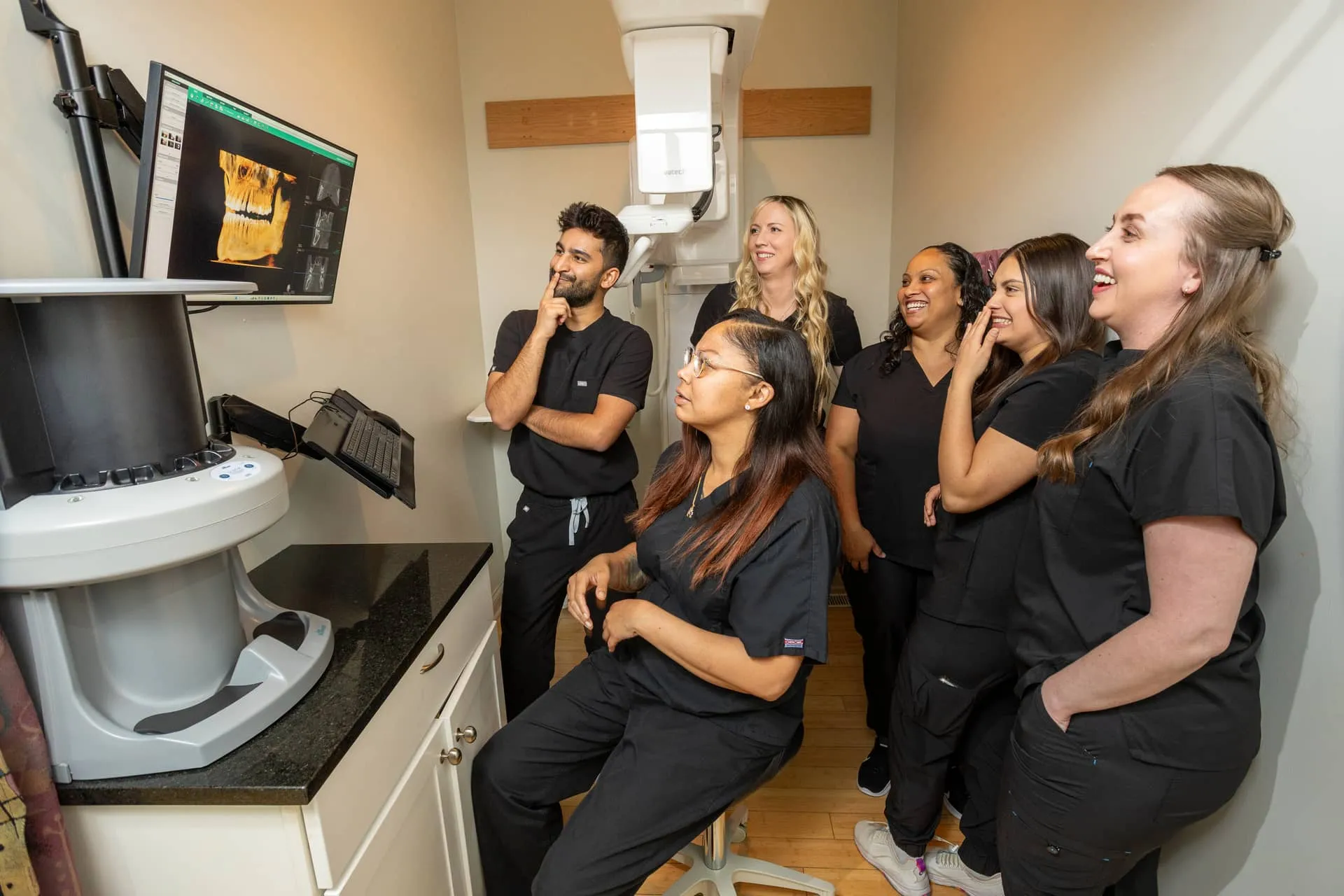 The Big City Dental team reviewing a 3D scan in the Lakeview office